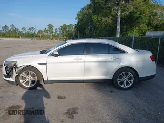 2013 Ford Taurus SEL z VIN 1FAHP2E88DG214441, wystawiony jako IAAI lot #42232859 z przebiegiem 122 388 mil mil oraz . Historia ofert i sprzedaży dostępna na DreamBid. Obrazek 14.