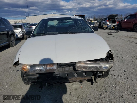 1996 Saturn SL with VIN 1G8ZK5279TZ162812, listed as a Copart auction lot 87079874 with 143,461 mi miles and Salvage title. Bid and sale history available at DreamBid. Image 5.