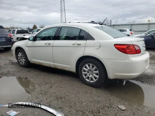 2010 Chrysler Sebring Touring with VIN 1C3CC4FB7AN112467, listed as a Copart auction lot 80875114 with 128,874 mi miles and Salvage Title. Bid and sale history available at carsss.com. Image 2.
