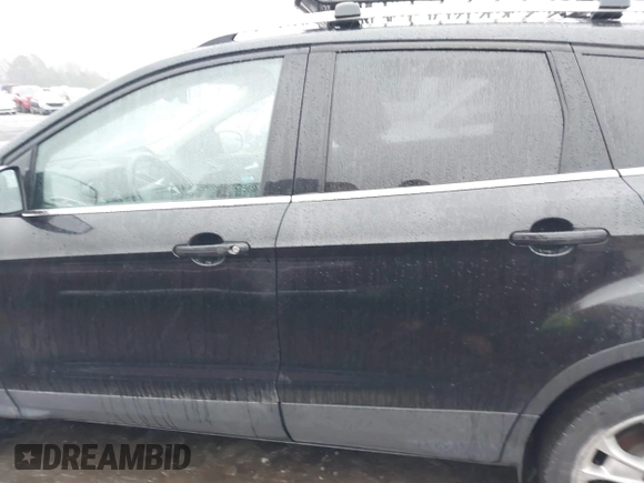 2015 Ford Escape Titanium with VIN 1FMCU0J97FUB45709, listed as a IAAI auction lot 41561636 with 88,296 mi miles. Bid and sale history available at carsss.com. Image 14.