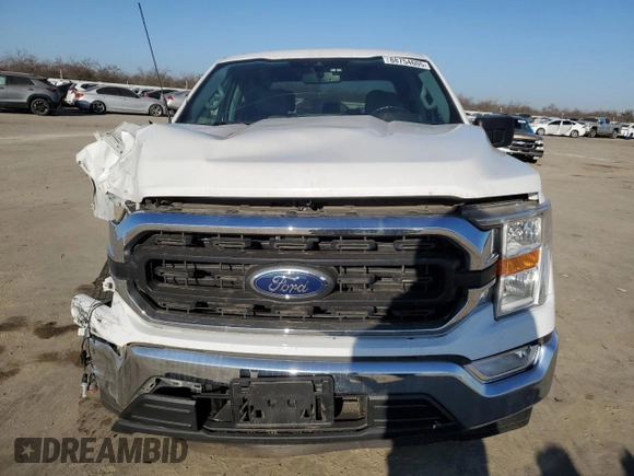 2021 Ford F-150 XL with VIN 1FTEW1CP8MFD11312, listed as a Copart auction lot 88754605 with 142,224 mi miles and Salvage title. Bid and sale history available at DreamBid. Image 5.