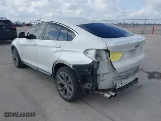 2015 BMW X4 xDrive28i with VIN 5UXXW3C53F0M88714, listed as a IAAI auction lot 41483692 with 132,054 mi miles. Bid and sale history available at carsss.com. Image 3.