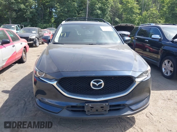 2017 Mazda CX-5 Touring z VIN JM3KFBCL5H0133493, wystawiony jako IAAI lot #39666644 z przebiegiem 125 048 mil mil oraz . Historia ofert i sprzedaży dostępna na DreamBid. Obrazek 13.