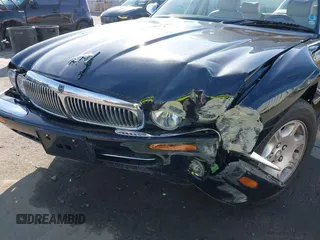2003 Jaguar XJ 8 with VIN SAJDA14C03LF58706, listed as a IAAI auction lot 41619740 with 95,293 mi miles and . Bid and sale history available at DreamBid. Image 6.