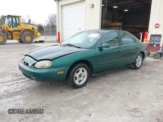 1999 Mercury Sable GS with VIN 1MEFM50U5XG633589, listed as a IAAI auction lot 41614442 with 241,833 mi miles. Bid and sale history available at carsss.com. Image 2.