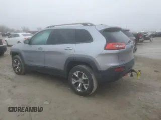 2014 Jeep Cherokee Trailhawk with VIN 1C4PJMBS1EW240177, listed as a Copart auction lot 43321715 with 212,339 mi miles and Salvage title. Bid and sale history available at DreamBid. Image 2.
