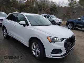 2020 Audi Q3 Premium with VIN WA1AECF34L1053074, listed as a IAAI auction lot 41441179 with 99,556 mi miles. Bid and sale history available at carsss.com. Image 1.