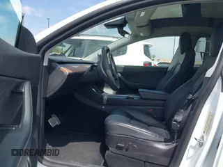 2022 Tesla Model Y Performance with VIN 7SAYGDEF8NF407109, listed as a IAAI auction lot 42014282 with 24,937 mi miles and . Bid and sale history available at DreamBid. Image 5.