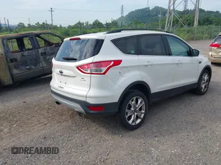 2014 Ford Escape SE with VIN 1FMCU9G99EUA09575, listed as a IAAI auction lot 42615476 with 107,948 mi miles and . Bid and sale history available at DreamBid. Image 4.