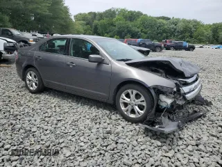 2012 Ford Fusion SE with VIN 3FAHP0HA0CR355529, listed as a Copart auction lot 62585515 with 113,094 mi miles and Salvage title. Bid and sale history available at DreamBid. Image 4.