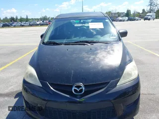 2009 Mazda 5 Sport with VIN JM1CR293290331607, listed as a IAAI auction lot 41907557 with 149,523 mi miles. Bid and sale history available at carsss.com. Image 6.