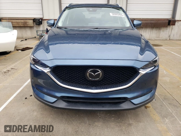 2018 Mazda CX-5 Grand Touring with VIN JM3KFADM8J1351624, listed as a Copart auction lot 50965465 with 66,210 mi miles and Salvage Title. Bid and sale history available at DreamBid. Image 5.