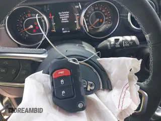2022 Jeep Wrangler Unlimited Sahara Altitude with VIN 1C4HJXEG3NW194042, listed as a IAAI auction lot 42643314 with 32,091 mi miles and . Bid and sale history available at DreamBid. Image 11.