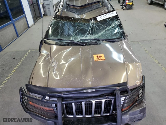 2001 Jeep Grand Cherokee Laredo with VIN 1J4GW48N01C529690, listed as a Copart auction lot 82037774 with 142,673 mi miles and Salvage Title. Bid and sale history available at carsss.com. Image 12.