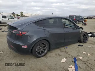 2025 Tesla Model Y Long Range with VIN 7SAYGDED6SF227475, listed as a Copart auction lot 42634345 with 3,493 mi miles and Salvage Title. Bid and sale history available at DreamBid. Image 3.