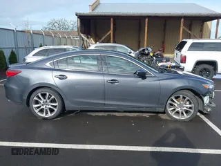 2014 Mazda 6 i Grand Touring with VIN JM1GJ1W63E1147380, listed as a IAAI auction lot 41928637 with 140,091 mi miles and . Bid and sale history available at DreamBid. Image 14.