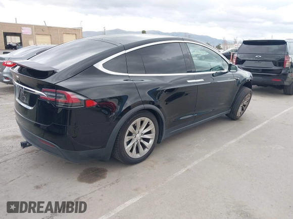2017 Tesla Model X 90D with VIN 5YJXCAE2XHF075341, listed as a IAAI auction lot 41784008 with 77,439 mi miles and . Bid and sale history available at DreamBid. Image 4.