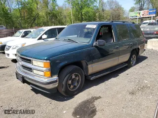 1999 Chevrolet Tahoe with VIN 1GNEC13R2XJ536828, listed as a Copart auction lot 53610465 with 201,276 mi miles and Salvage Title. Bid and sale history available at carsss.com. Image 1.