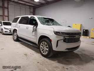 2023 Chevrolet Suburban Premier with VIN 1GNSCFKD8PR299995, listed as a IAAI auction lot 41607729 with 64,549 mi miles. Bid and sale history available at carsss.com. Image 1.