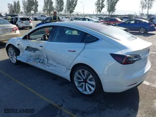 2018 Tesla Model 3 Long Range Battery with VIN 5YJ3E1EA0JF008351, listed as a IAAI auction lot 41129459 with 36,518 mi miles. Bid and sale history available at carsss.com. Image 3.