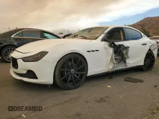2014 Maserati Ghibli z VIN ZAM57XSA7E1127888, wystawiony jako Copart lot #71117984 z przebiegiem 59 961 mil mil oraz Nie do naprawy. Historia ofert i sprzedaży dostępna na DreamBid. Obrazek 1.