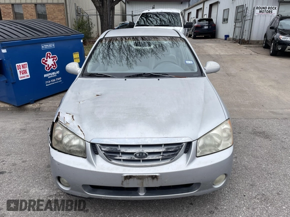 2004 Kia Spectra LX with VIN KNAFE121845043143, listed as a IAAI auction lot 41574523 with 211,758 mi miles. Bid and sale history available at carsss.com. Image 11.
