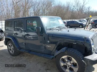 2016 Jeep Wrangler Unlimited 75th Anniversary with VIN 1C4BJWEG9GL250408, listed as a IAAI auction lot 41793706 with 102,436 mi miles. Bid and sale history available at carsss.com. Image 13.
