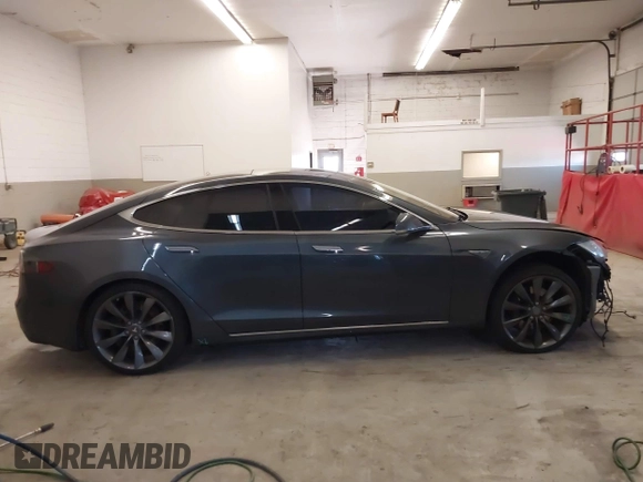 2014 Tesla Model S 60 with VIN 5YJSA1H13EFP49912, listed as a IAAI auction lot 41716661 with 129,776 mi miles and . Bid and sale history available at DreamBid. Image 14.