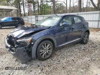 2016 Mazda CX-3 Grand Touring z VIN JM1DKBD79G0107590, wystawiony jako Copart lot #50063715 z przebiegiem 116 288 mil mil oraz Szkody całkowita. Historia ofert i sprzedaży dostępna na DreamBid. Obrazek 1.