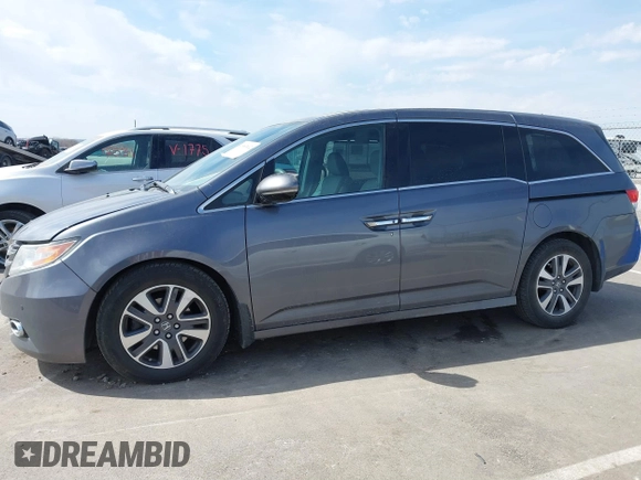 2014 Honda Odyssey Touring with VIN 5FNRL5H91EB093540, listed as a IAAI auction lot 41887412 with 202,076 mi miles and . Bid and sale history available at DreamBid. Image 14.