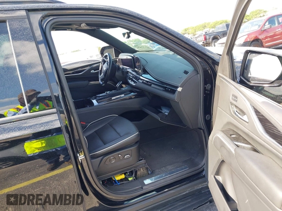 2023 Cadillac Escalade 4WD Sport z VIN 1GYS4EKLXPR513435, wystawiony jako IAAI lot #42137452 z przebiegiem 27 495 mil mil oraz . Historia ofert i sprzedaży dostępna na DreamBid. Obrazek 5.