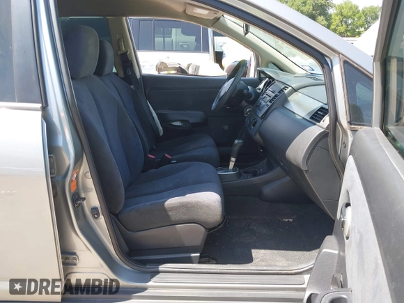 2009 Nissan Versa 1.8 SL with VIN 3N1BC13E19L372298, listed as a IAAI auction lot 42011338 with 131,882 mi miles. Bid and sale history available at carsss.com. Image 5.