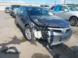 2014 Toyota Avalon Limited z VIN 4T1BK1EB5EU113554, wystawiony jako IAAI lot #42220169 z przebiegiem 161 988 mil mil oraz . Historia ofert i sprzedaży dostępna na DreamBid. Obrazek 1.