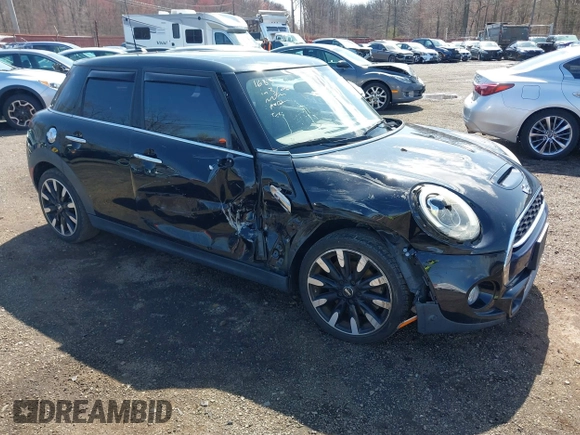 2017 MINI Hardtop 4 Door Cooper S z VIN WMWXU3C39H2F48699, wystawiony jako IAAI lot #41924423 z przebiegiem 81 249 mil mil oraz . Historia ofert i sprzedaży dostępna na DreamBid. Obrazek 1.