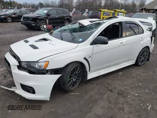 2014 Mitsubishi Lancer Evolution GSR with VIN JA32W8FV5EU012572, listed as a IAAI auction lot 40871463 with 89,529 mi miles. Bid and sale history available at carsss.com. Image 20.