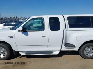 1998 Ford F-150 XL with VIN 1FTZX072XWKA12003, listed as a IAAI auction lot 41765328 with 119,445 mi miles and . Bid and sale history available at DreamBid. Image 14.