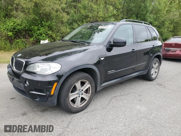 2012 BMW X5 35d with VIN 5UXZW0C54CL671377, listed as a Copart auction lot 60936395 with 105,903 mi miles and Salvage title. Bid and sale history available at DreamBid. Image 1.