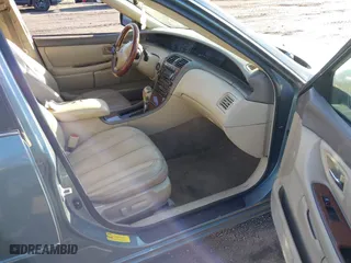 2003 Toyota Avalon XL with VIN 4T1BF28BX3U277269, listed as a IAAI auction lot 41589582 with 129,895 mi miles. Bid and sale history available at carsss.com. Image 5.