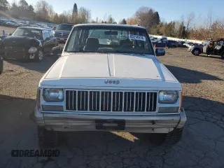 1993 Jeep Cherokee Country with VIN 1J4FJ78S0PL565292, listed as a Copart auction lot 83214974 with 233,925 mi miles and Clean Title. Bid and sale history available at carsss.com. Image 5.