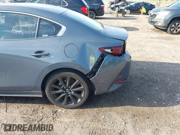 2024 Mazda 3 S Carbon Edition with VIN 3MZBPBCM6RM411828, listed as a IAAI auction lot 42802141 with 40,061 mi miles and . Bid and sale history available at DreamBid. Image 6.