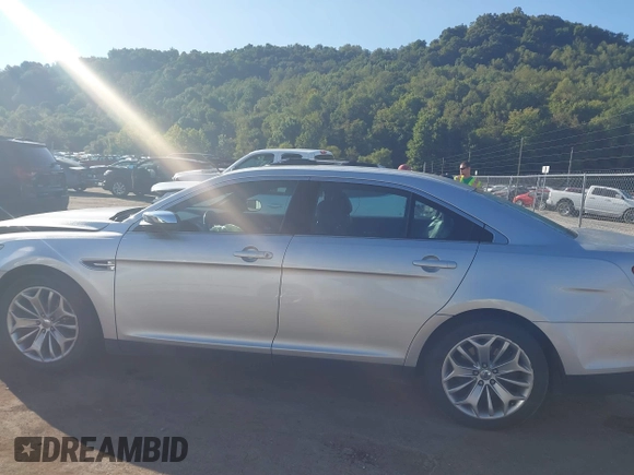 2014 Ford Taurus Limited with VIN 1FAHP2F8XEG133523, listed as a IAAI auction lot 40285220 with 134,939 mi miles. Bid and sale history available at carsss.com. Image 14.