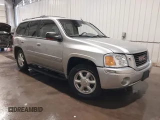 2004 GMC Envoy SLE with VIN 1GKDT13S042243883, listed as a IAAI auction lot 41795335 with 162,873 mi miles. Bid and sale history available at carsss.com. Image 1.