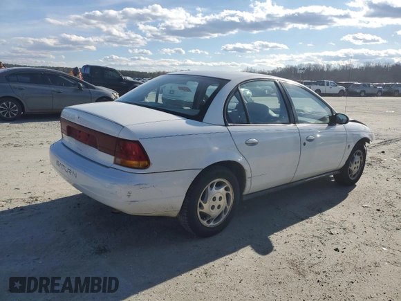 1996 Saturn SL with VIN 1G8ZK5279TZ162812, listed as a Copart auction lot 87079874 with 143,461 mi miles and Salvage title. Bid and sale history available at DreamBid. Image 3.