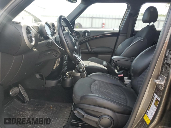 2012 MINI Countryman S with VIN WMWZC5C5XCWL56232, listed as a Copart auction lot 60298705 with 140,425 mi miles and Salvage title. Bid and sale history available at DreamBid. Image 7.