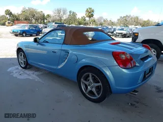 2003 Toyota MR2 Spyder with VIN JTDFR320130057360, listed as a IAAI auction lot 41696384 with 52,621 mi miles. Bid and sale history available at carsss.com. Image 3.