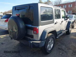 2015 Jeep Wrangler Unlimited Sport with VIN 1C4BJWDG4FL732123, listed as a IAAI auction lot 41864714 with 142,382 mi miles. Bid and sale history available at carsss.com. Image 4.