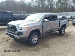 2018 Toyota Tacoma SR with VIN 3TMCZ5AN4JM130307, listed as a IAAI auction lot 41541477 with 74,369 mi miles and . Bid and sale history available at DreamBid. Image 2.