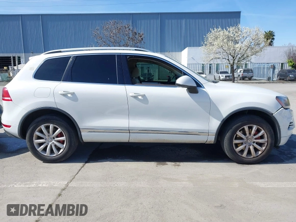 2012 Volkswagen Touareg Sport with VIN WVGEF9BP5CD007294, listed as a IAAI auction lot 41841268 with 160,883 mi miles and . Bid and sale history available at DreamBid. Image 13.