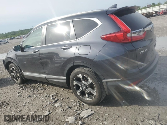 2018 Honda CR-V Touring z VIN 7FARW2H94JE077885, wystawiony jako Copart lot #55451345 z przebiegiem 133 964 mil mil oraz Szkoda całkowita • Salvage title. Historia ofert i sprzedaży dostępna na DreamBid. Obrazek 2.