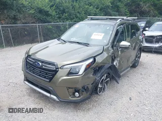 2023 Subaru Forester Touring with VIN JF2SKARC6PH400678, listed as a IAAI auction lot 42694547 with 14,484 mi miles and . Bid and sale history available at DreamBid. Image 2.
